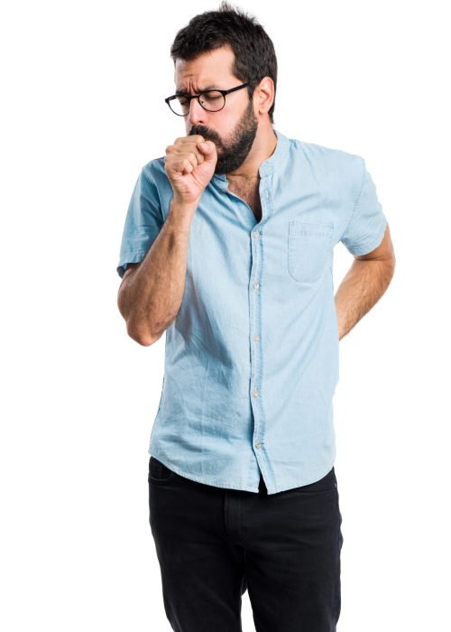 Handsome man with blue glasses coughing a lot